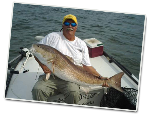 Doug and a 42 pound 50 inch bull red.